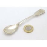 A 19thC Irish silver fiddle pattern mustard spoon with armorial to handle.