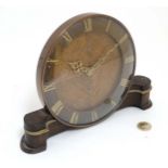 1940/50's mantleclock : an oak cased Smiths integral wind circular timepiece with brass Roman