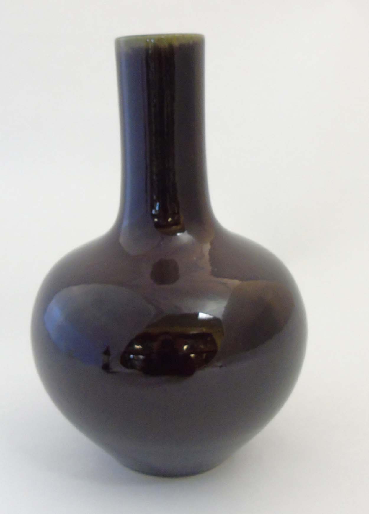 A Chinese Sang de Boeuf bottle vase with globular body and tall cylindrical neck, - Image 2 of 8