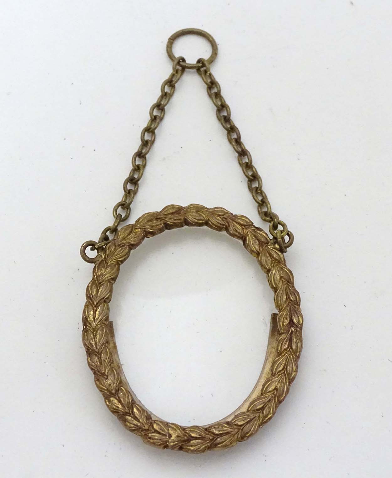 A circa 1900 small oval Victorian brass frame with oval glass and hanging chain , - Image 3 of 5