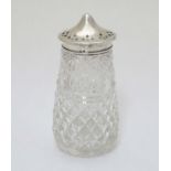 A cut glass sugar sifter / caster with silver top hallmarked Birmingham 1927. 5" high overall.