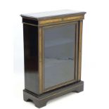 A mid / late 19thC ebonised pier cabinet, with gilt painted decoration and moulding,