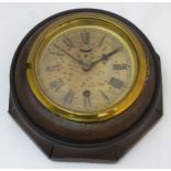 Waterbury Wall Clock : a walnut stained beech octagonal cased, 30 hour timepiece ,