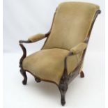 A Victorian rosewood open armchair with shaped and swept arms,