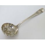 A silver sifter spoon with fruit decoration hallmarked London 1748.