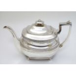 A Geo III silver teapot with banded basket weave decoration,