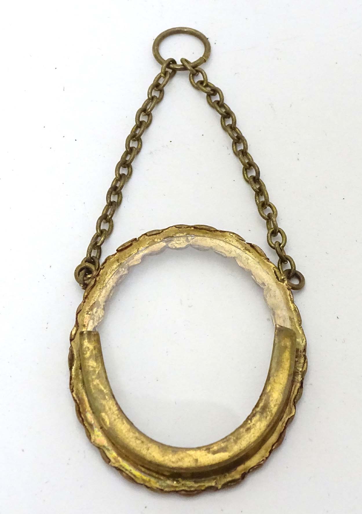 A circa 1900 small oval Victorian brass frame with oval glass and hanging chain , - Image 2 of 5