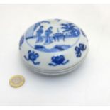 A Chinese blue and white circular ink pot and cover,