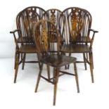 A set of 6 (4+2) mid / late 20thC oak wheelback chairs with supported backrests and pierced back