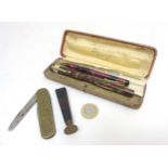 A cased ' Majestic No 1 ' lever self filling fountain pen, having 14k gold nib and red-gold finish ,