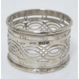 A silver napkin ring with frettwork decoration. hallmarked Birmingham 1912 maker F H Adams Ltd.