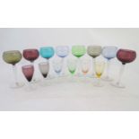 A set of 8 coloured German Hock wine glasses together with a set of 6 smaller pedestal glasses ,