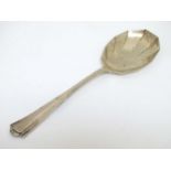 An Art Deco silver serving spoon hallmarked Sheffield 1931 maker Thomas Bradbury & Sons Ltd.