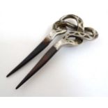 A tortoiseshell hair comb / hair pin / mantilla with silver decoration hallmarked Birmingham c.