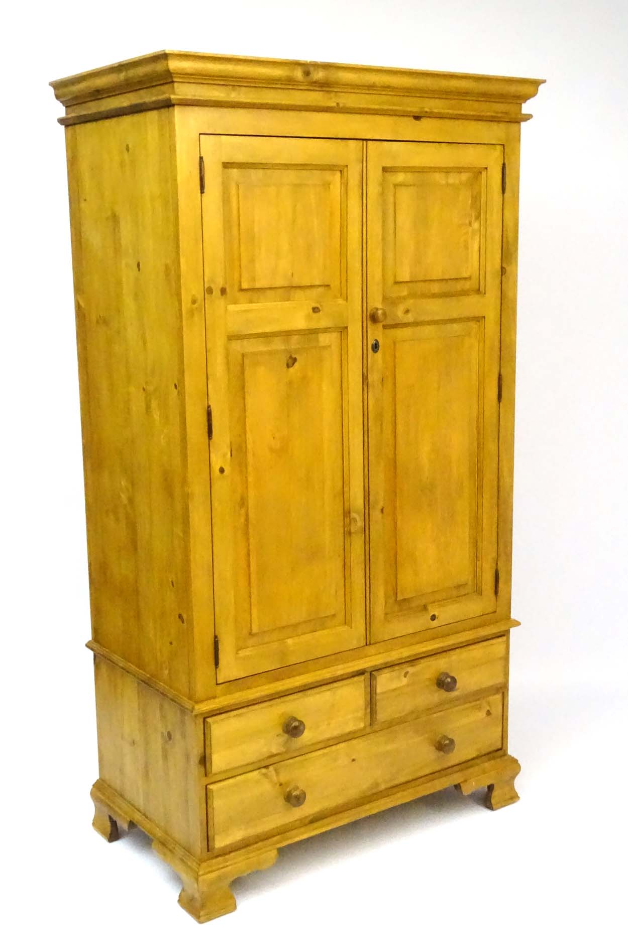 A mid / late 20thC pine wardrobe with an ovolo moulded top above two doors containing storage space - Image 8 of 9