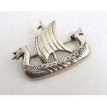A Scottish silver brooch formed as a Viking / Nordic long boat.
