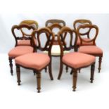 A Victorian matched set of eight mahogany dining chairs with balloon style backrests,