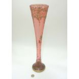 Glass : an early to mid XX tall Cranberry vase with applied scroll enamel and gilded base and lip ,