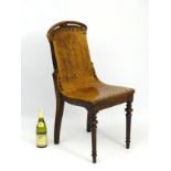 A 19thC beech chair with pierced back splat and seat, brass stud detailing,