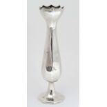 A silver vase of octagonal baluster form. Hallmarked Birmingham 1921 maker Henry Williamson Ltd.