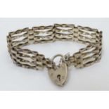 A silver bracket with padlock clasp CONDITION: Please Note - we do not make