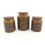 Three Retro Hornsea brown 'Heirloom' storage jars with wooden lids to include tea,