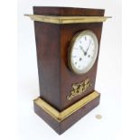French Empire clock : an 8 day Mahogany and brass clock With signed convex enamel dial marked '
