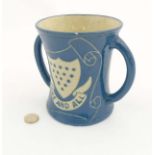 A Lauder Barum two handled 'Loving Cup' / mug decorated in a blue glaze to exterior, unglazed base,