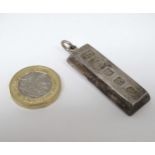 A silver pendant of ingot form hallmarked Sheffield 1977, with silver jubilee mark. Maker JD.