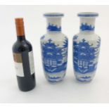 A pair of Chinese blue and white Rouleau vases,