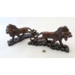 A pair of c.1920 oriental carved hardwood figures of lions. Originally from Kowloon.