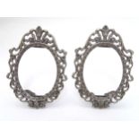 A pair of white metal photograph / miniature frames of oval form. Marked . 800 each 5" high overall.