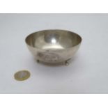 A Continental 800 silver bowl with twin lion decoration and standing on 3 outsewpt feet 3 3/4"