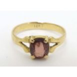 An 18k ring set with red stone CONDITION: Please Note - we do not make reference