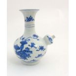 A Chinese blue and white kendi vase with flared rim,