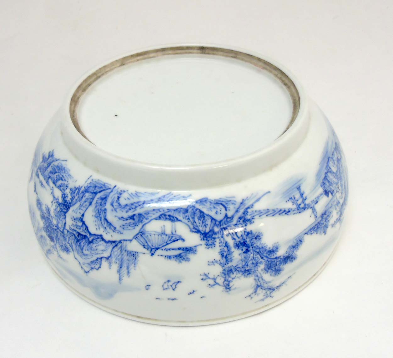A Chinese blue and white bowl decorated in an underglaze blue continuous landscape and iron red - Image 2 of 8