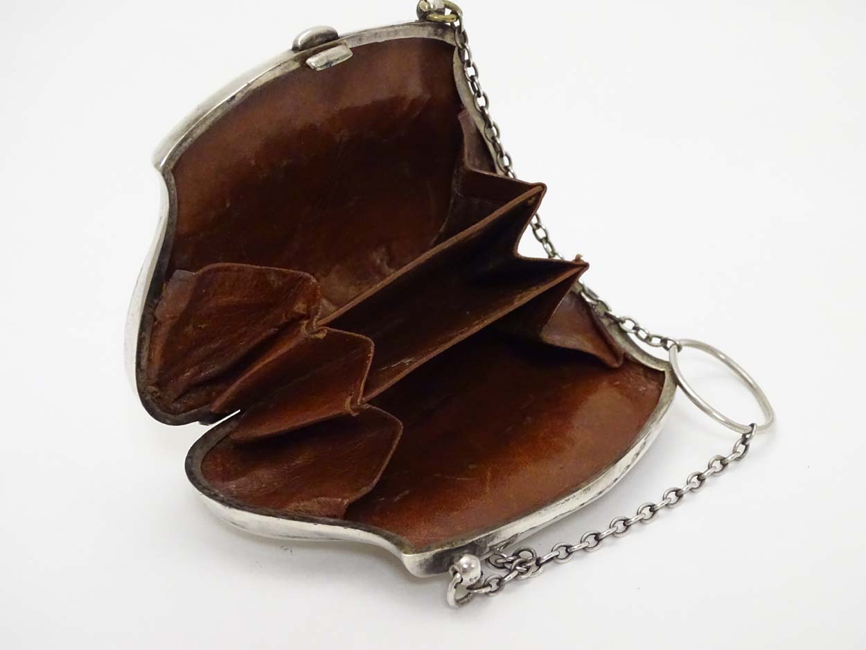 A silver purse with brown leather interior. Hallmarked Birmingham 1909. - Image 11 of 14