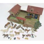 A 1920/30s Elastoin farm yard with farmer and various animals, comprising, trough, tree, 3 pigs,