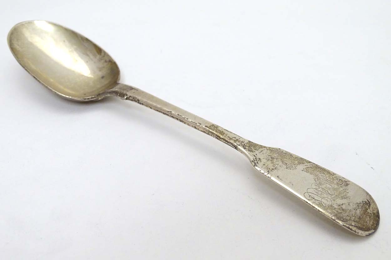 A silver fiddle pattern dessert spoon hallmarked London 1843 maker WE 7"long (46g)