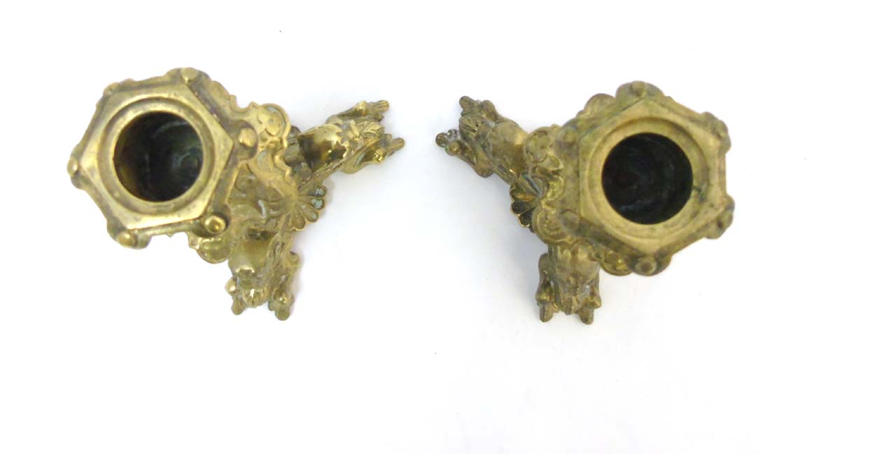 A pair of cast brass tri-form candlesticks having organic formed pedestal and 3 horned beasts to - Image 6 of 7