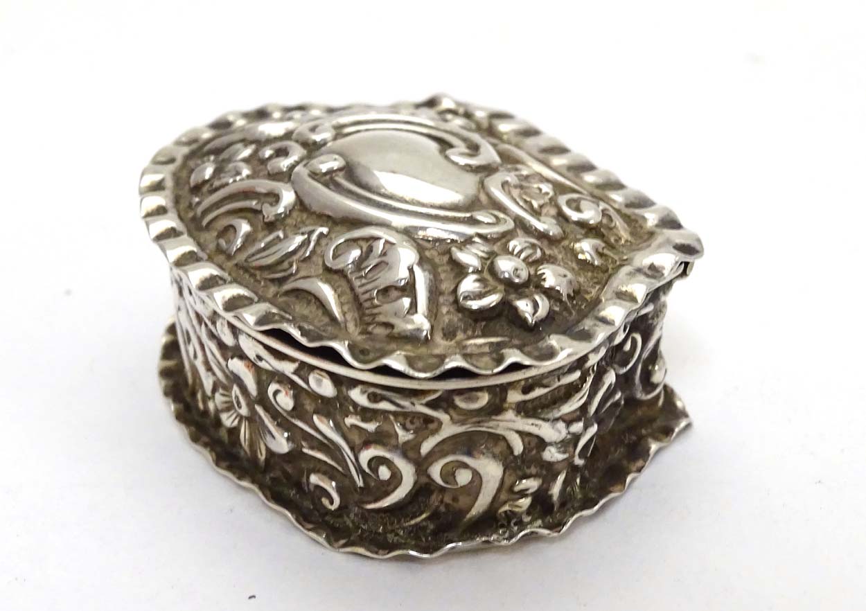 A Victorian silver small box with embossed decoration. - Image 3 of 7