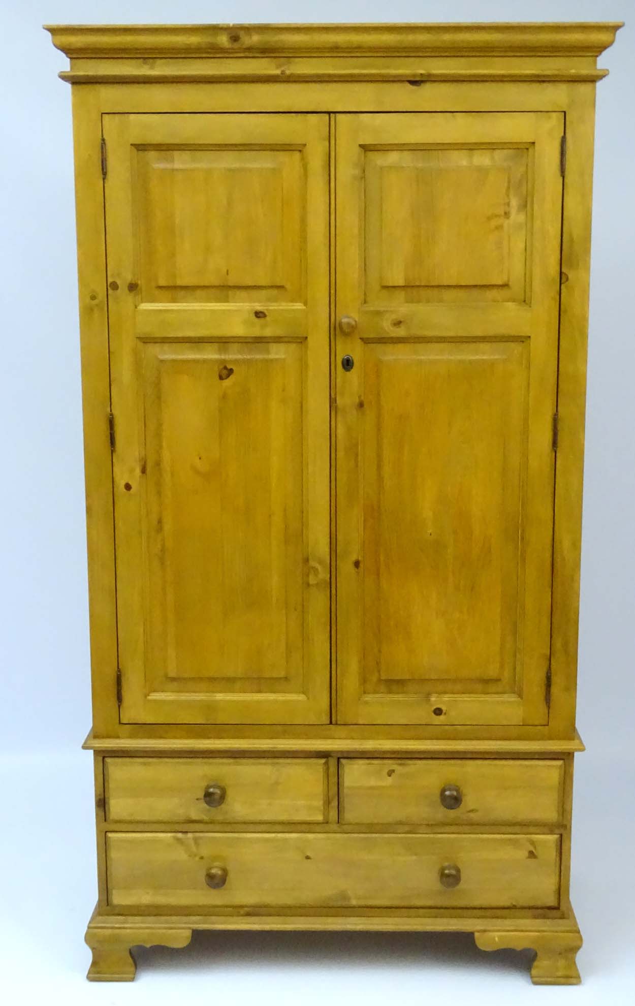 A mid / late 20thC pine wardrobe with an ovolo moulded top above two doors containing storage space - Image 3 of 9