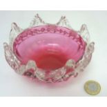 Glass : a Victorian Cranberry glass bowl with ground pontil under and pinched clear glass edge and