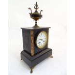 French Marble with urn finial : an 8 day 3 1/2” enamel dial mantle clock signed ' J Larrogue Vic