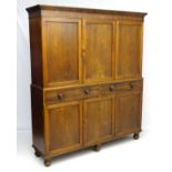 A late 19thC mahogany large two sectional cupboard,