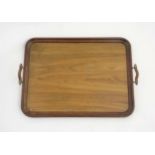 A c. 1900 mahogany and olive wood 2 handled tray , measuring 23" long x 17" wide.