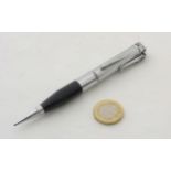 The Penciliter : A chrome plated protracting pencil and lighter as one.