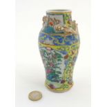 A Chinese Cantonese famille jaune vase of baluster form,