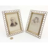 A pair of 19thC flattened curb link framed photograph frames with laurel decoration,