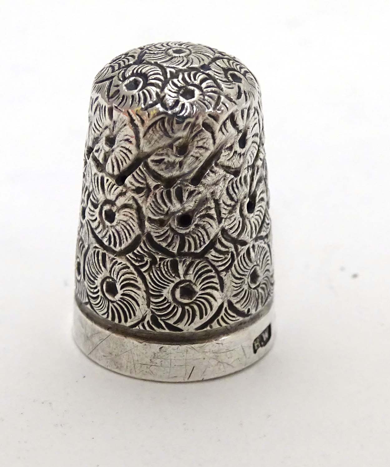 A Victorian silver thimble hallmarked 1896 maker Francis Webb.